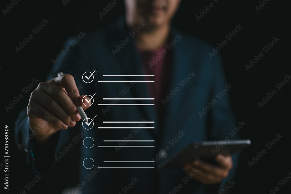 Poster Document management system DMS. Questionnaire, Assessment form, checklist and clipboard task management. Businessman working on laptop computer productivity checklist and filling survey..