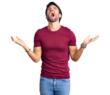 Handsome hispanic man wearing casual clothes crazy and mad shouting and yelling with aggressive expression and arms raised. frustration concept.