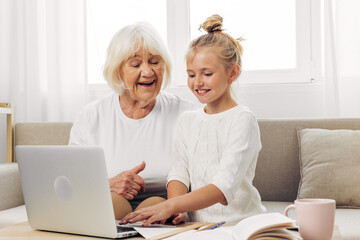 Child bonding selfie family hugging grandmother laptop