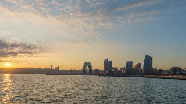 Cityscape skyline sunset timelapse video capture of the iconic Crescent and TV tower, Baku Azerbaijan 4K Day to night