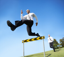 Businessman, hurdle and jumping for career competition or employee obstacle, opponent or...