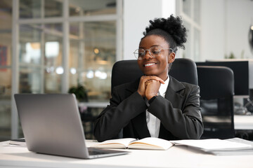 Happy woman working at table in office. Lawyer, businesswoman, accountant or manager - obrazy, fototapety, plakaty