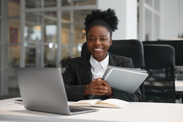 Happy woman with folders working at table in office. Lawyer, businesswoman, accountant or manager - obrazy, fototapety, plakaty