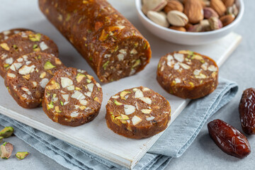 dates nuts roll salami, delicious natural raw vegan dessert, healthy food concept