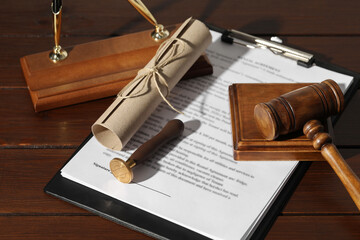 Notary contract. Wax stamp, documents, gavel and pen holder on wooden table