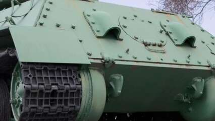 World War II monument featuring a real T-44 tank on a pedestal, commemorating soldiers who fought in 1944 against German occupation.