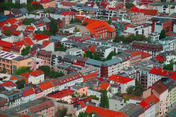 July 1st 2023 - Berlin houses background up view from TV tower. Red, grey and city green urban...