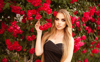 Young Female Black Top Windy Wavy Hair Portrait in Rose Flower Garden Golden Hour Head Turned Curious Looking