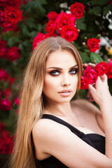 Young Female Black Top Windy Wavy Hair Portrait in Rose Flower Garden Golden Hour Head Turned Curious Looking