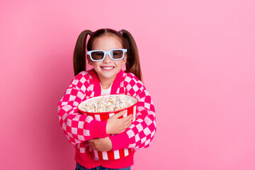 Photo of positive cute adorable girl wear trendy clothes hug basket popcorn cartoon movie empty...