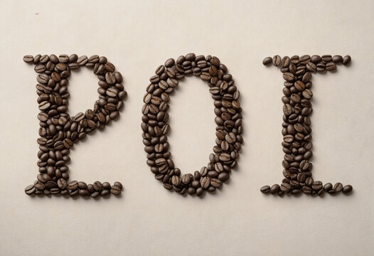 Text POI write by coffee beans. Royalty high-quality free stock macro photo image of shape POI design text by roasted black coffee beans, coffee beans background. Close-up or macro photo coffee bean