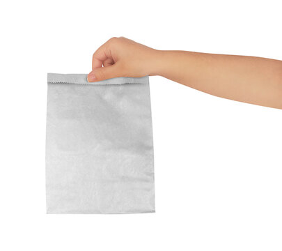 Hand Holding a Paper Kraft Bag on white background