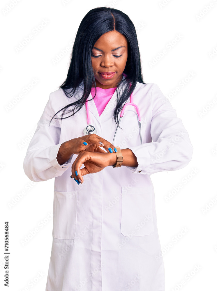 Sticker young african american woman wearing doctor stethoscope checking the time on wrist watch, relaxed an