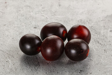 Raw ripe black kumato tomato