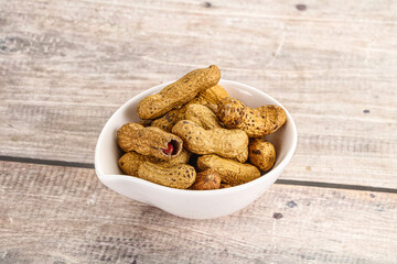 Raw ripe unpeeled peanut heap