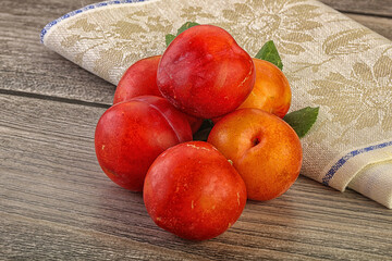 Red juicy raw plum heap