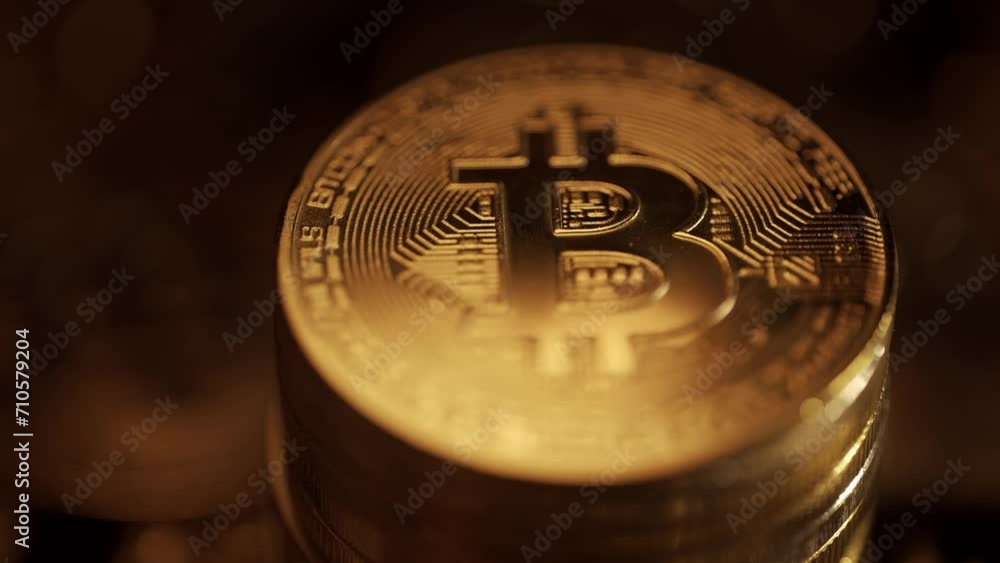 Poster golden bitcoin coins are rotating on a dark background. virtual cryptocurrency payment system and di