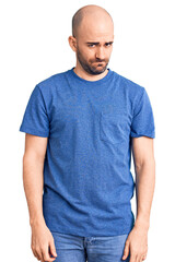 Fototapeta premium Young handsome man wearing casual t shirt skeptic and nervous, frowning upset because of problem. negative person.