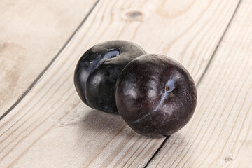 Two ripe sweet black plums