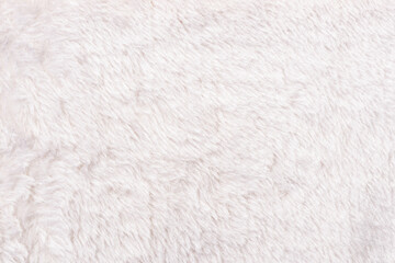 White faux fur fabric background texture. Full frame