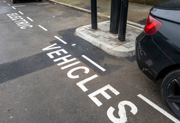 A newly installed charging point in a suburb of London, UK, with parking bays marked for electric...