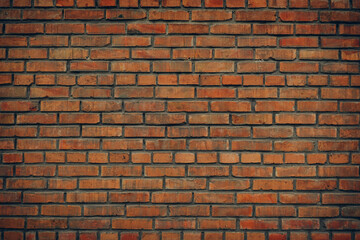 Close-up of a red brick wall with a detailed rustic texture, showcasing variations in color and pattern, perfect for backgrounds or design elements