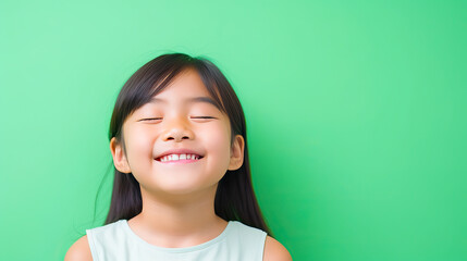 Happy girl smile against green background,  International Day of Happiness.,a mental health . ,Children day