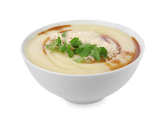 Delicious cream soup with parmesan cheese, soy sauce and parsley in bowl isolated on white