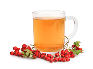Cup with hawthorn tea and berries isolated on white
