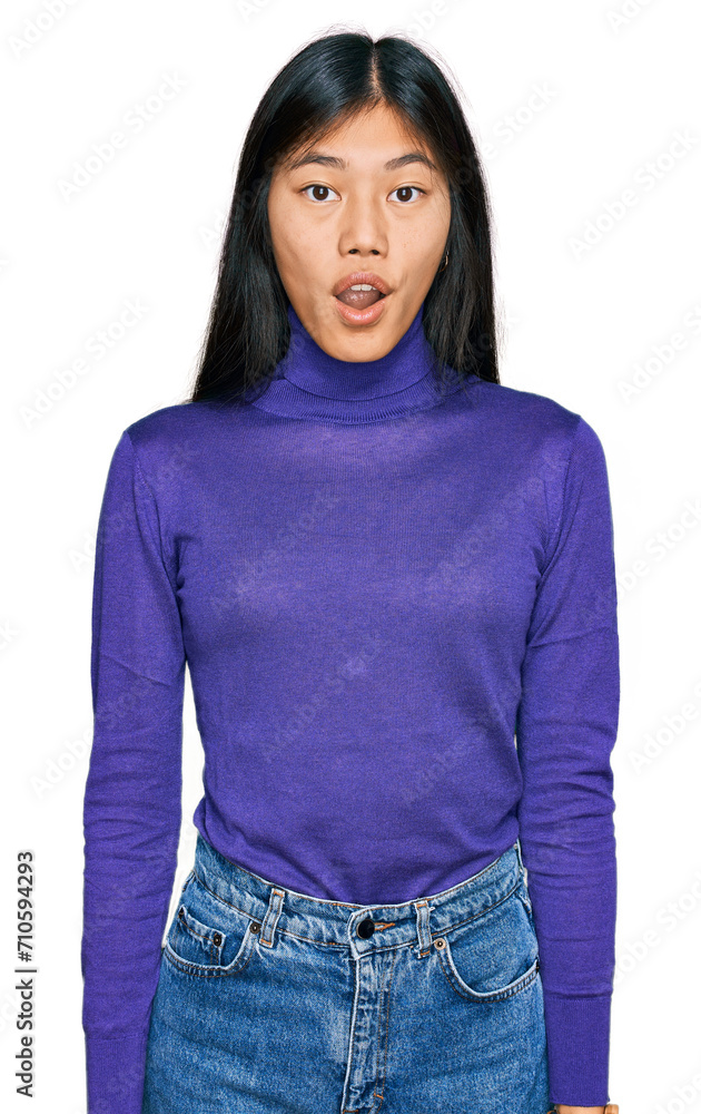 Canvas Prints Beautiful young asian woman wearing casual clothes afraid and shocked with surprise and amazed expression, fear and excited face.