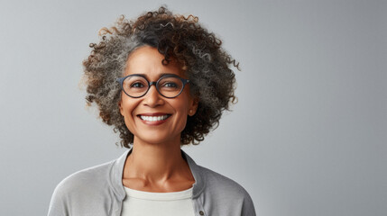 Young african american girl with curly hair wearing casual clothes winking looking at the camera with sexy expression, cheerful and happy face. - obrazy, fototapety, plakaty