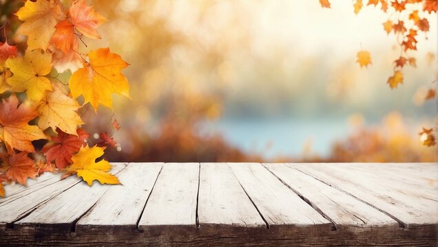 Background with an empty wooden table and a branch of autumn foliage. Autumn forest wallpaper with an empty space. Natural bokeh. Rays of light. Daylight.	