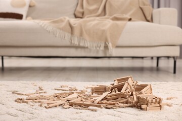 Wooden construction set on carpet indoors. Children's toy