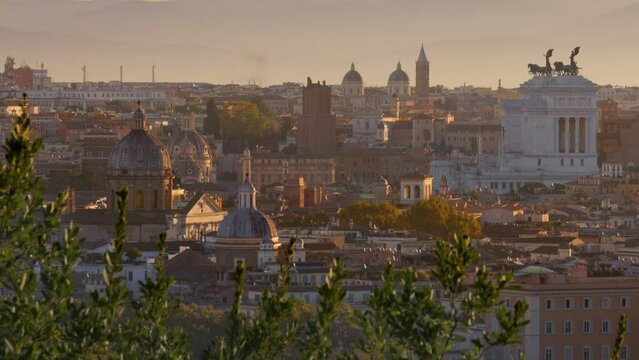 Beautiful Rome in morning lights of sun. Panning shot from Belvedere del Gianicolo. Churches and old town of Rome at sunrise, Italy
