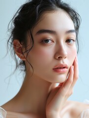 An Asian woman with clear skin advertising facial care cosmetics
