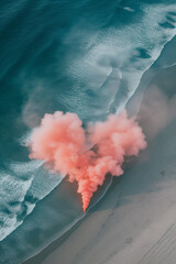 Flat lay of a beach with smoke in the shape of heart.