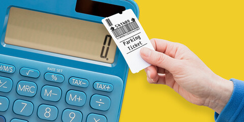 Parking costs concept with and holds a parking ticket - parking payment concept with calculator -...