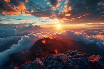 Breathtaking mountain sunset with clouds rolling over rugged peaks, warm sunlight casting a golden glow.

