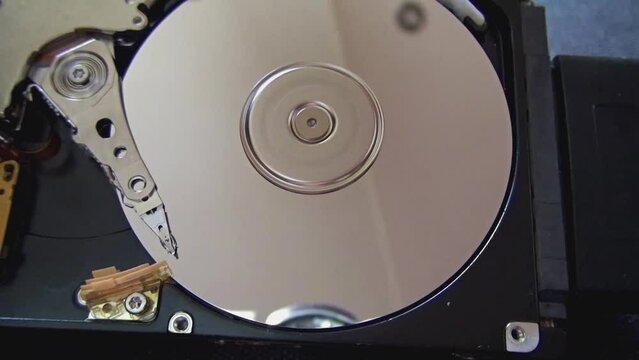 Interior of a damaged SSD hard drive while it is running.