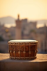 Ramadan drum on city rooftop during golden hour