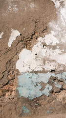 Pared deteriorada de estuco y pintura