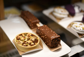 Sweet cakes with chocolate in a pastry shop