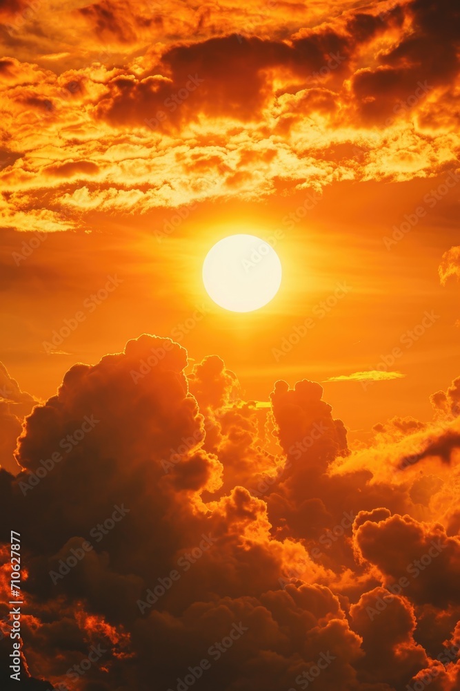 Poster a beautiful sunset as the sun sets over the clouds in the sky. this image can be used to depict the 