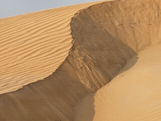 Desert sand texture with line pattern top view Spring sunset gates Sahara desert, with the sand...