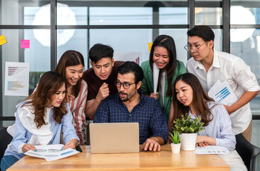 Group of creative asian business meeting and discussing strategy startup project analysis finance process.Success asian business people work plan and brainstorm marketing idea in office.Teamwork
