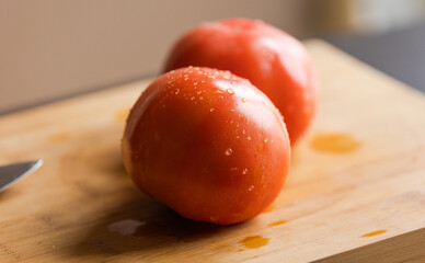 Ripe Elegance: Fresh Tomatoes on Wooden Board Close-Up