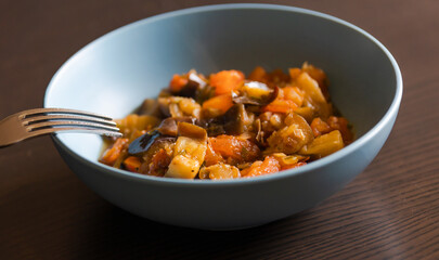 Soulful Comfort: Eggplant Stew in Blue Bowl Close-Up