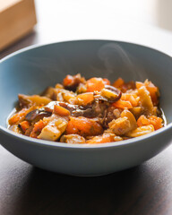 Soulful Comfort: Eggplant Stew in Blue Bowl Close-Up