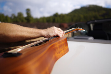 musician holding the guitar