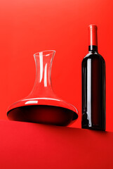 Red wine elegance: Decanter against a vibrant red background
